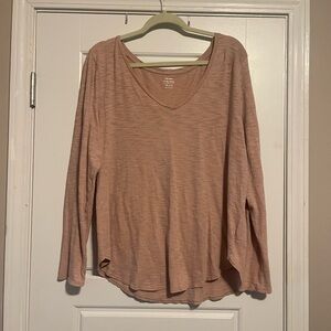 Washed out shade of pink long sleeve top.